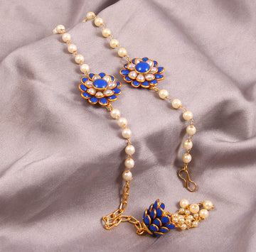 Elegant Pearl and Floral Rakhi Set on Silk Drape – Includes Free Chawal & Kumkum
