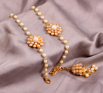 Elegant Pearl and Floral Rakhi Set on Silk Drape – Includes Free Chawal & Kumkum
